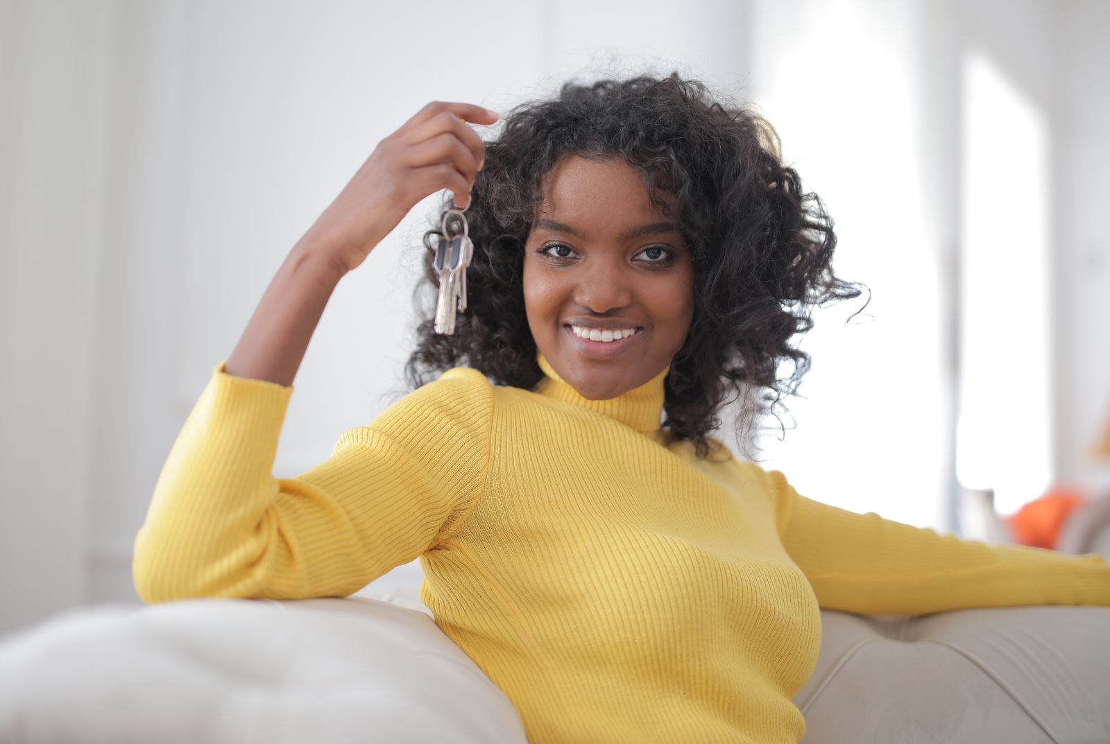 Woman holding the keys to her new home